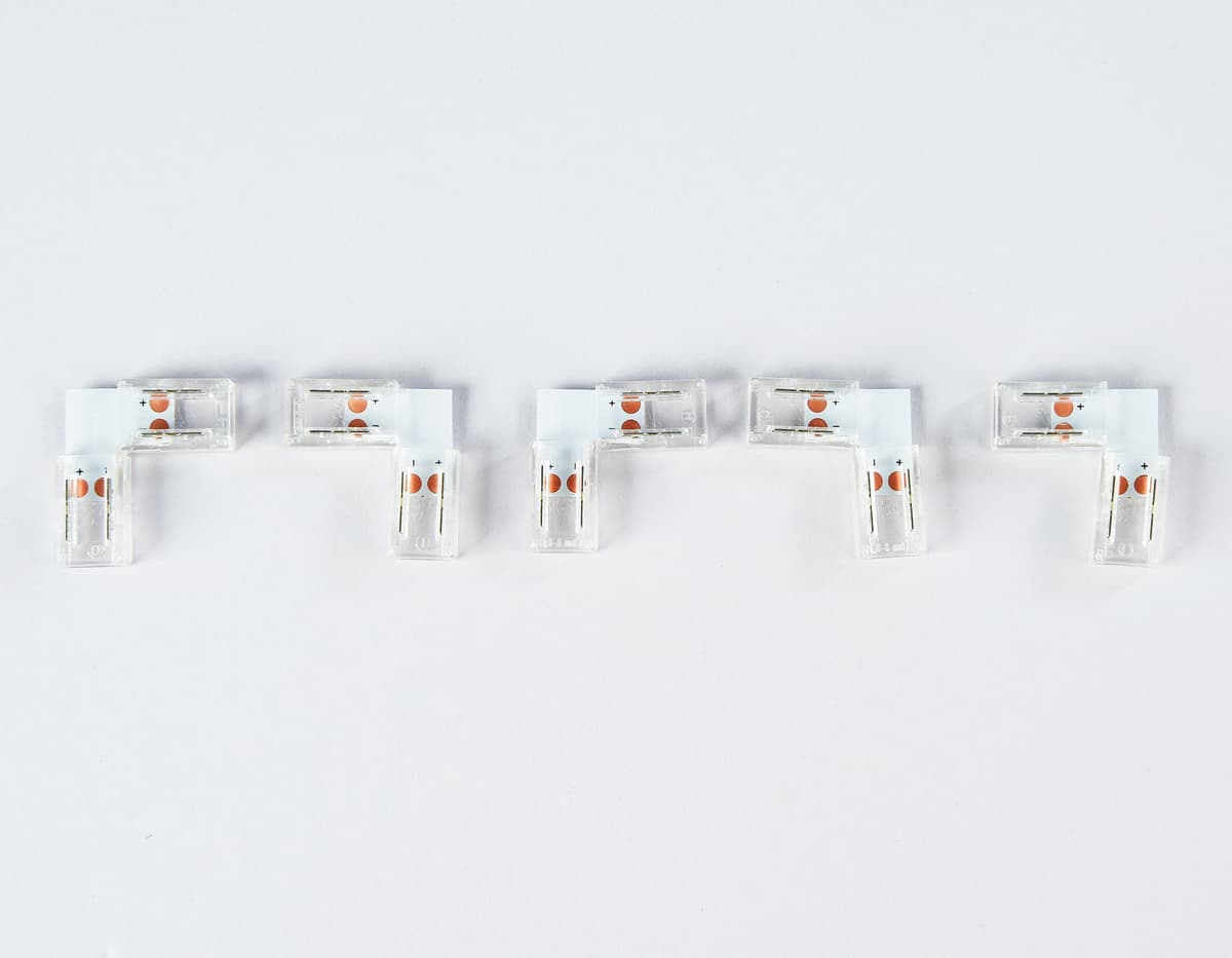 Соединитель угловой L для светодиодной ленты COB 8mm 12/24V (2 конт.) GS6851 (5шт) GS6851 Соединитель угловой L COB 12/24V для лент 8mm (2 конт.) (5шт) Ambrella Light 5