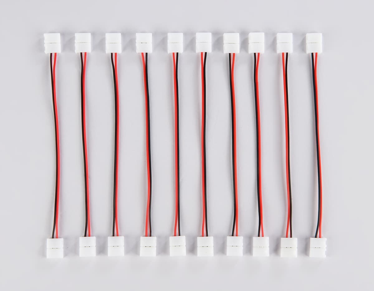 Соединитель гибкий двухсторонний для светодиодной ленты 2835 12/24V (2 конт.) 150 мм GS7551 (10шт) GS7551 Соединитель гибкий двухсторонний 2835 12/24V (2 конт.) (10шт) Ambrella Light 7